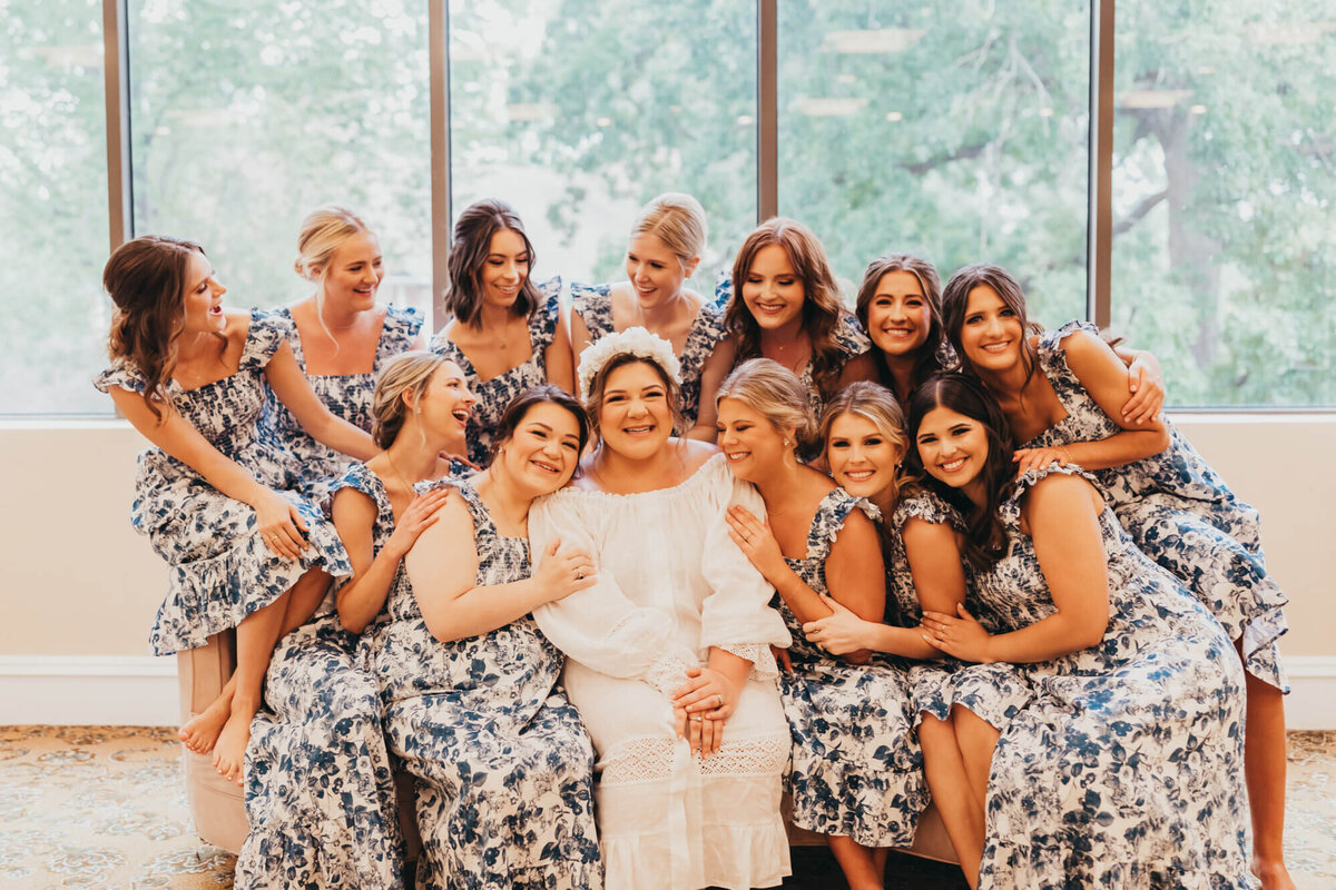 Houston wedding photographer allyson blankenburg captures bridesmaids loving on their friend, the bride.