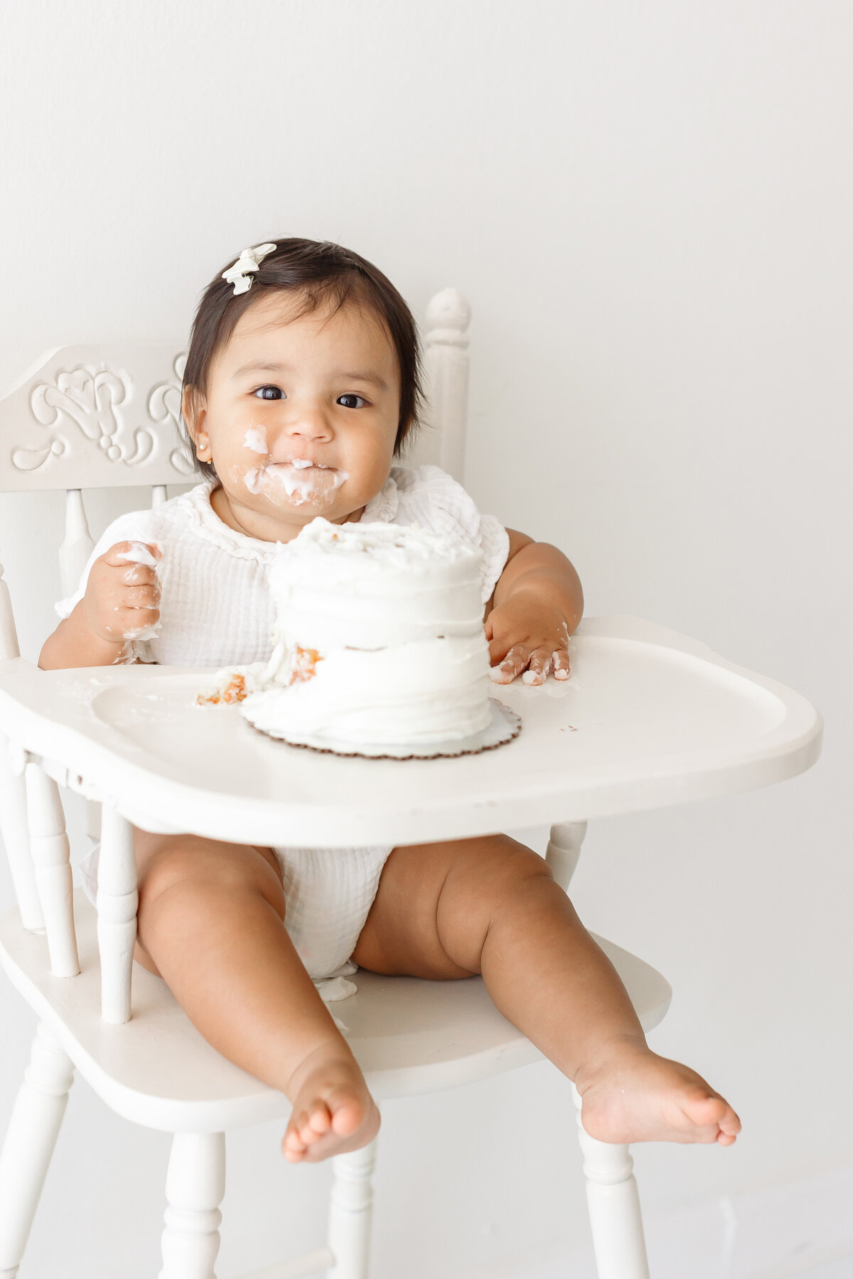 girl smiling with frosting on face
