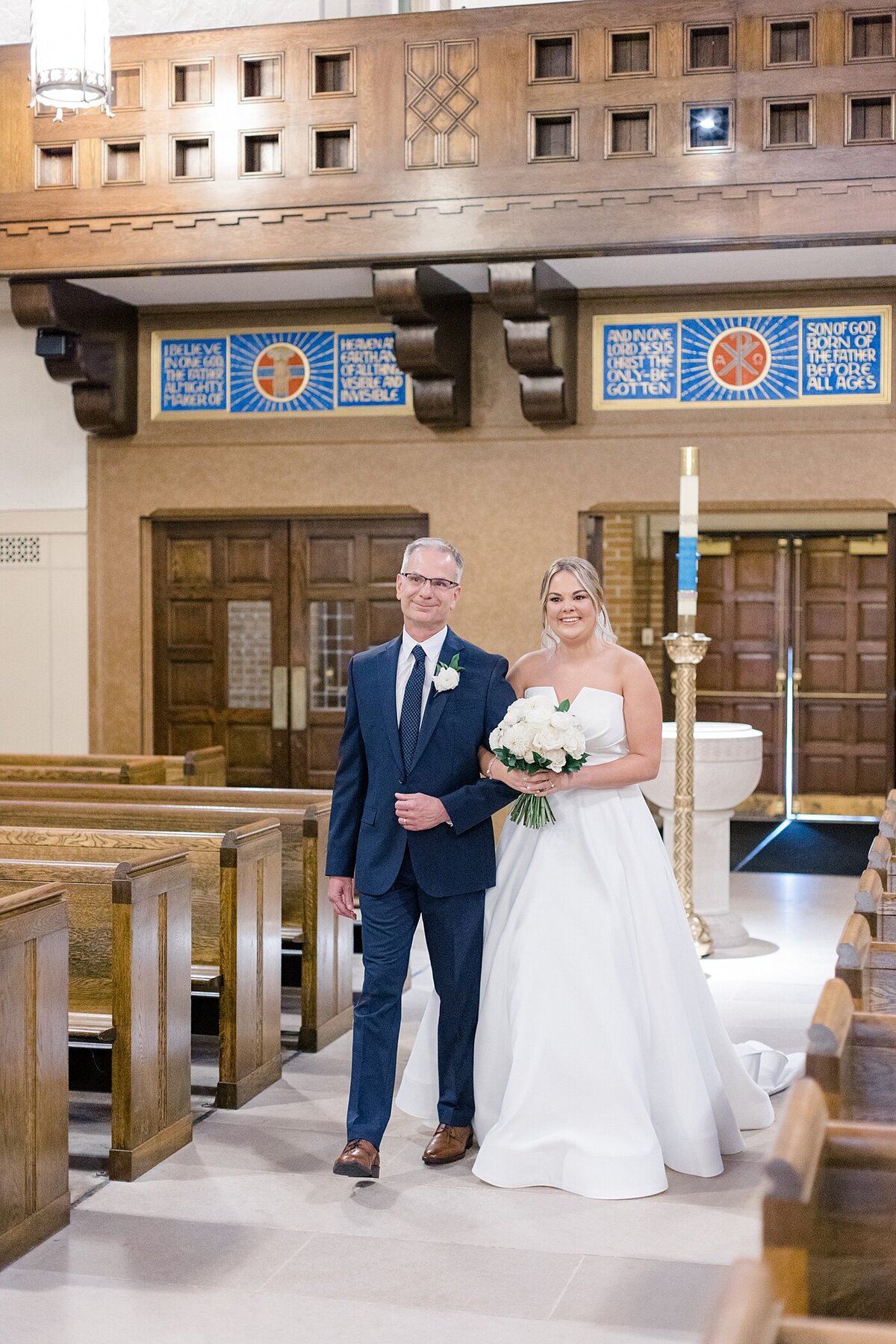 Bride walking down the aisle with her father at Ohio wedding