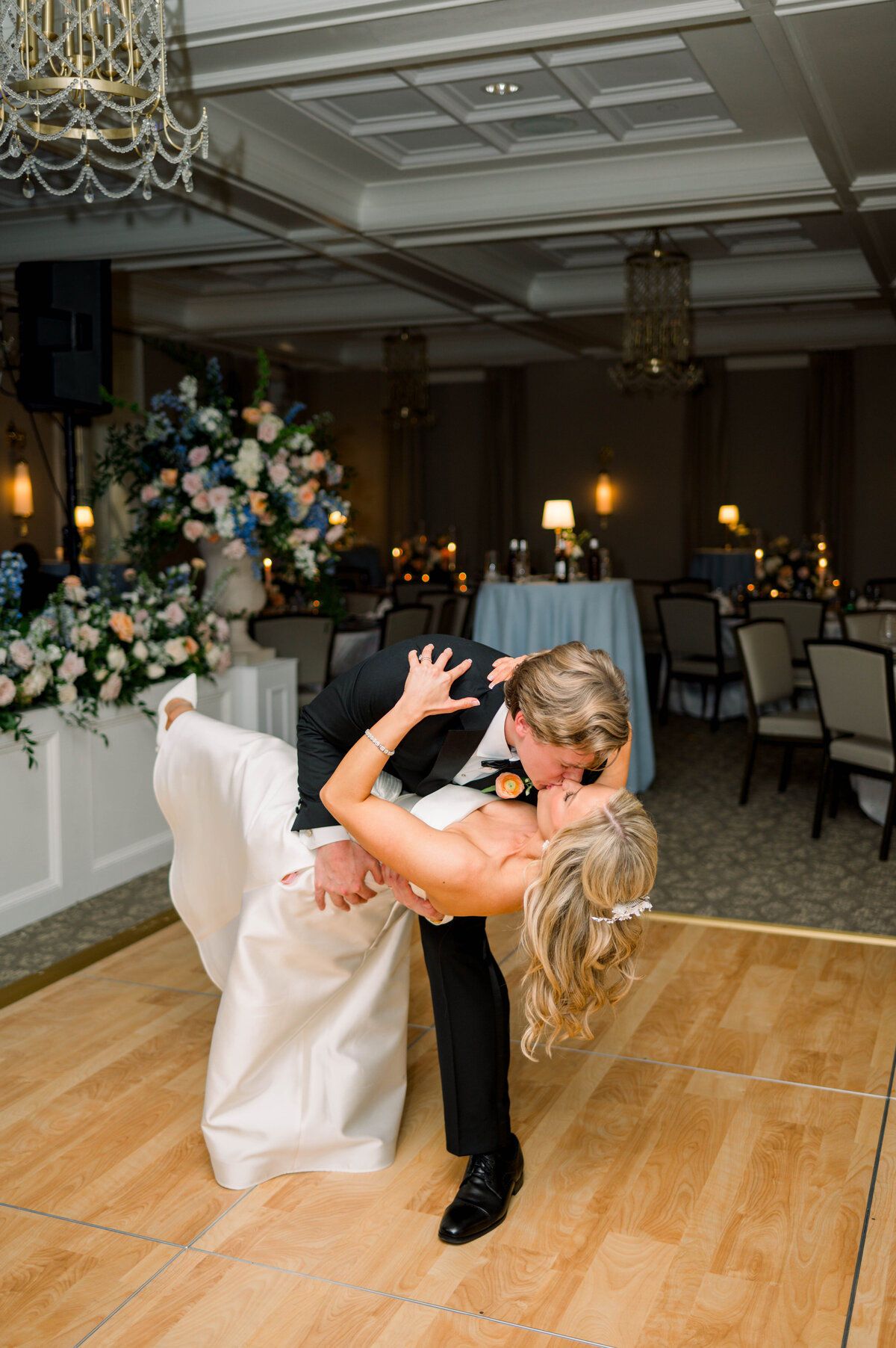 First dance under string lights at University Club wedding reception
