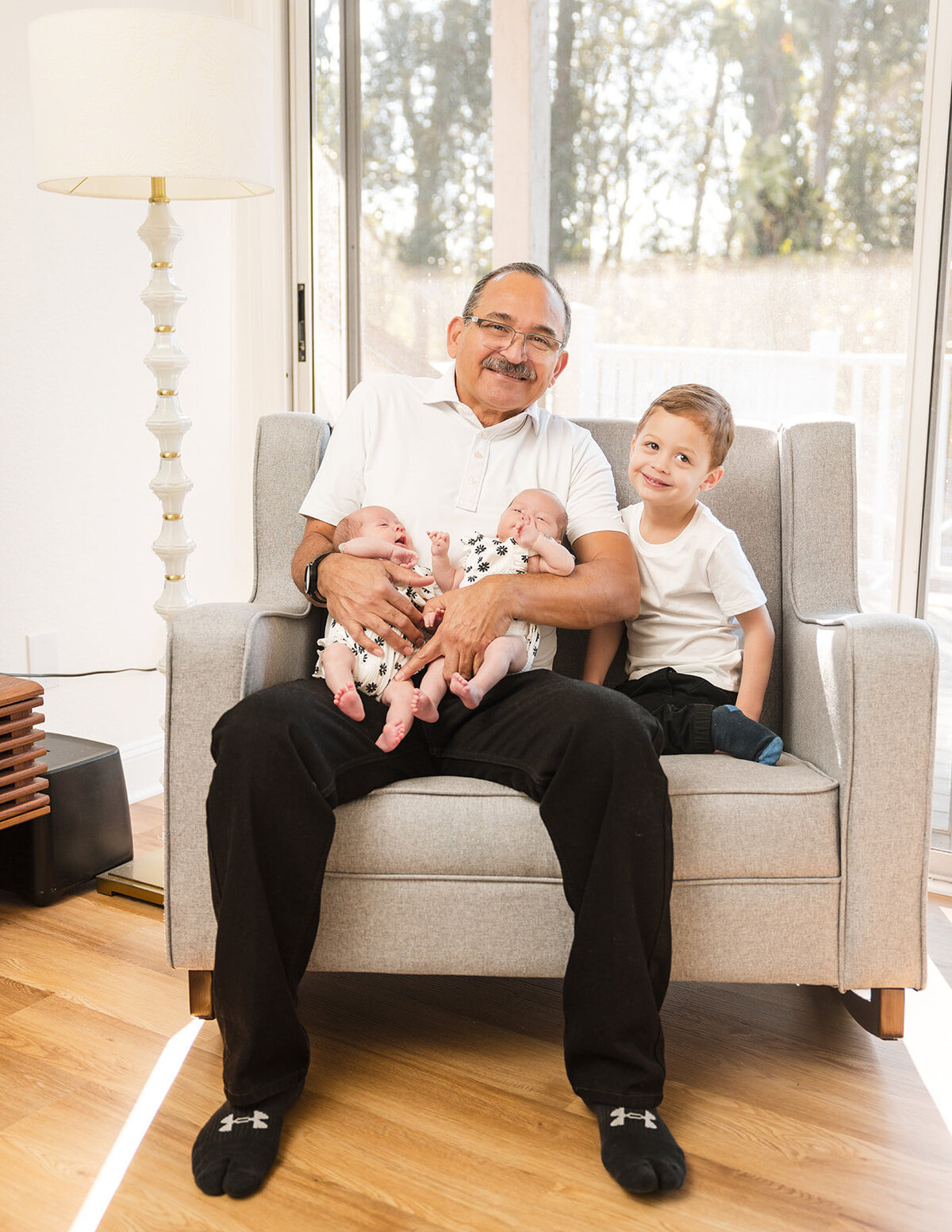 In-home lifestyle family session with mom, dad, toddler, and newborn in Orlando Florida home

