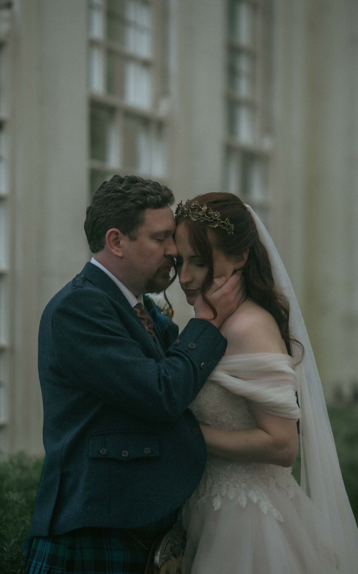 A tender moment shared between a couple, capturing the intimacy and connection that defines their love, set in a serene and beautiful environment