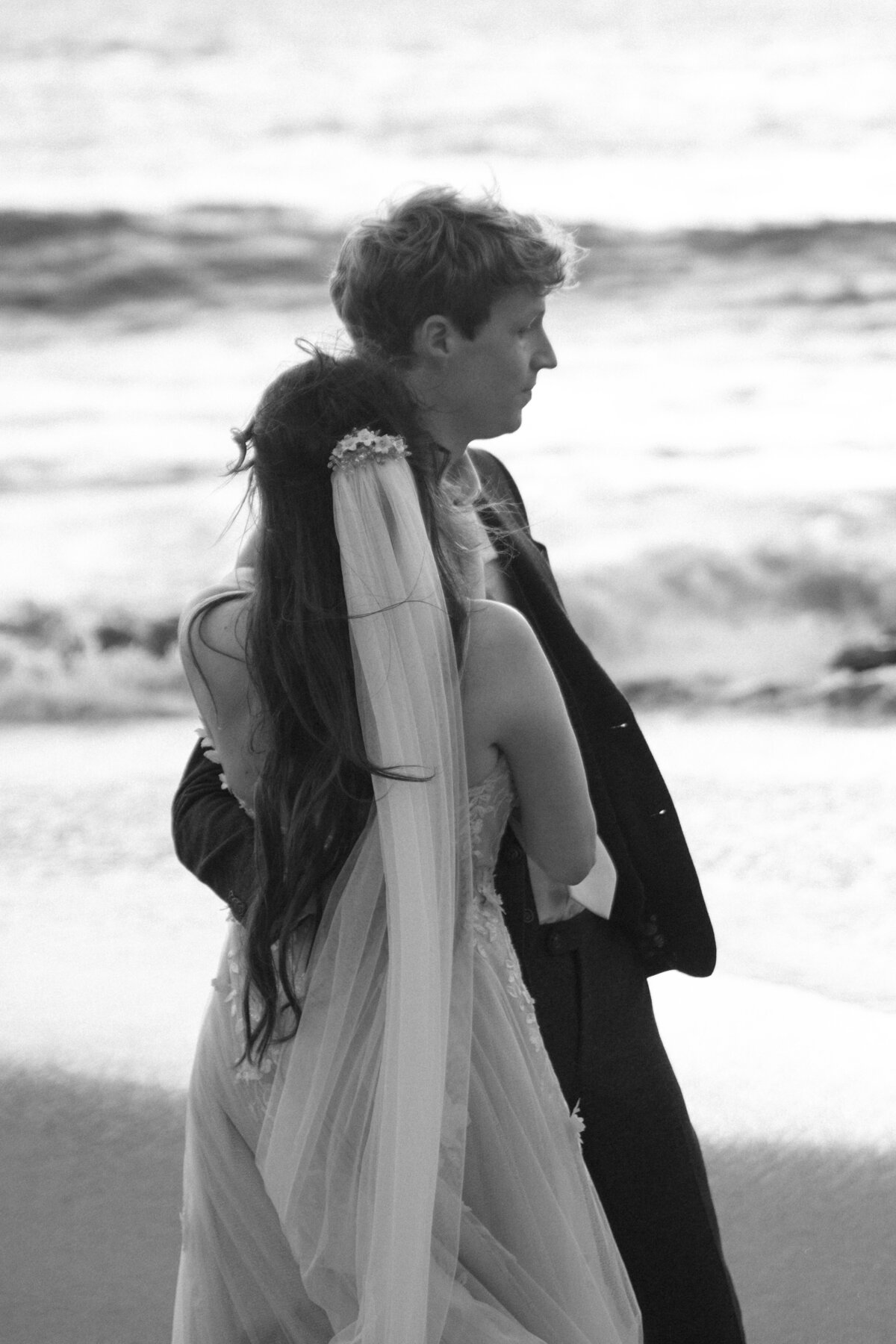 Bride and Groom at Marshall's Beach in San Francisco, California at sunset