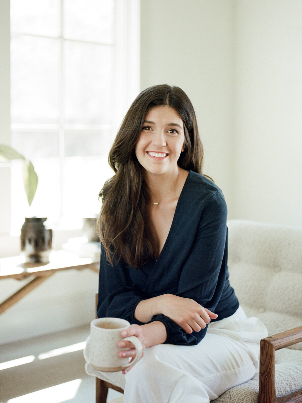 smiling designer film headshot, branding photography in Detroit, Michigan