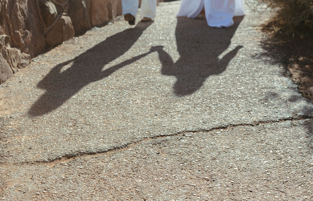 The shadow of a couple holding hands.