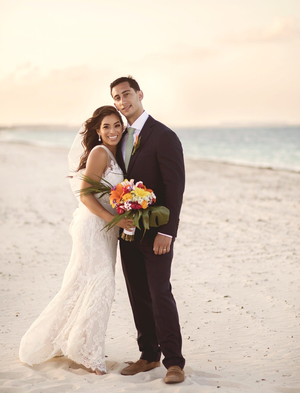 Portrait of bride and groom on beach at Finest Playa Mujeres