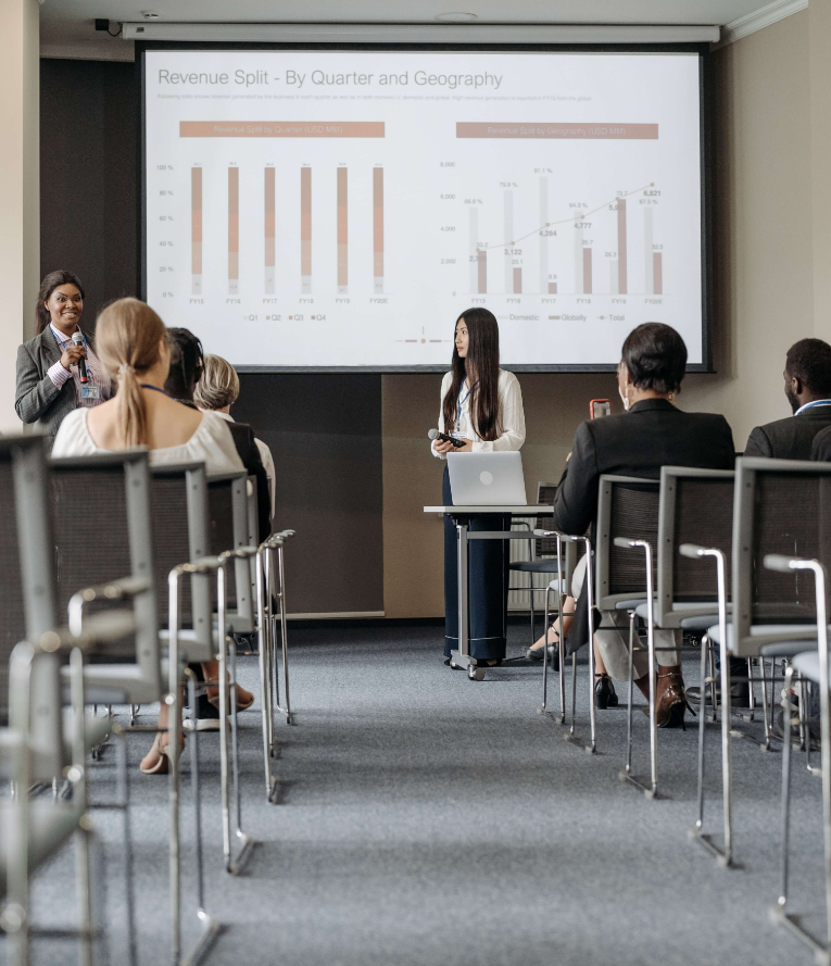 woman talking to group in meeting room