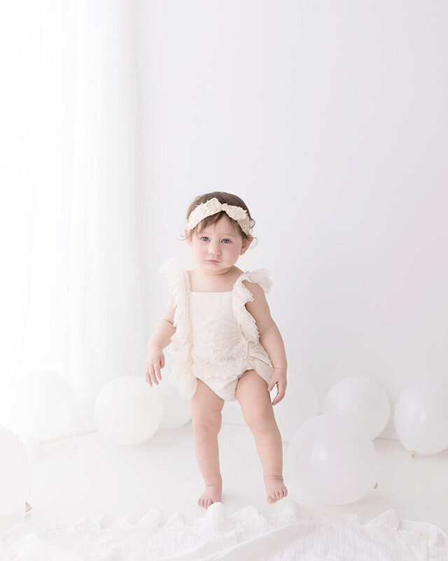 Baby girl taking her first steps