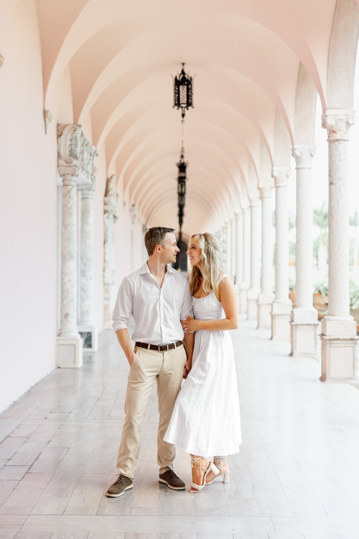 couple looking at each other in a hall by wedding photographer naples fl