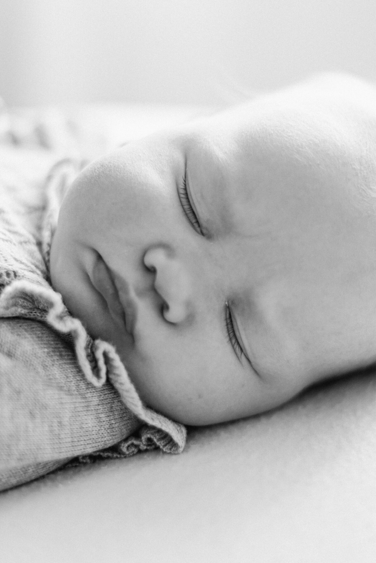 a baby girl asleep at billingshurst milestone photoshoot
