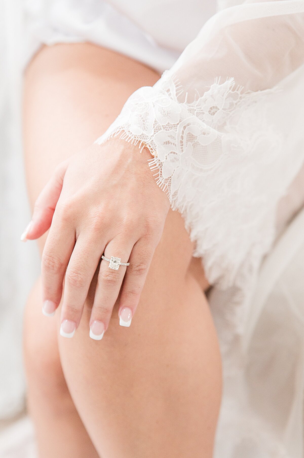 close up of bride engagement ring on wedding day