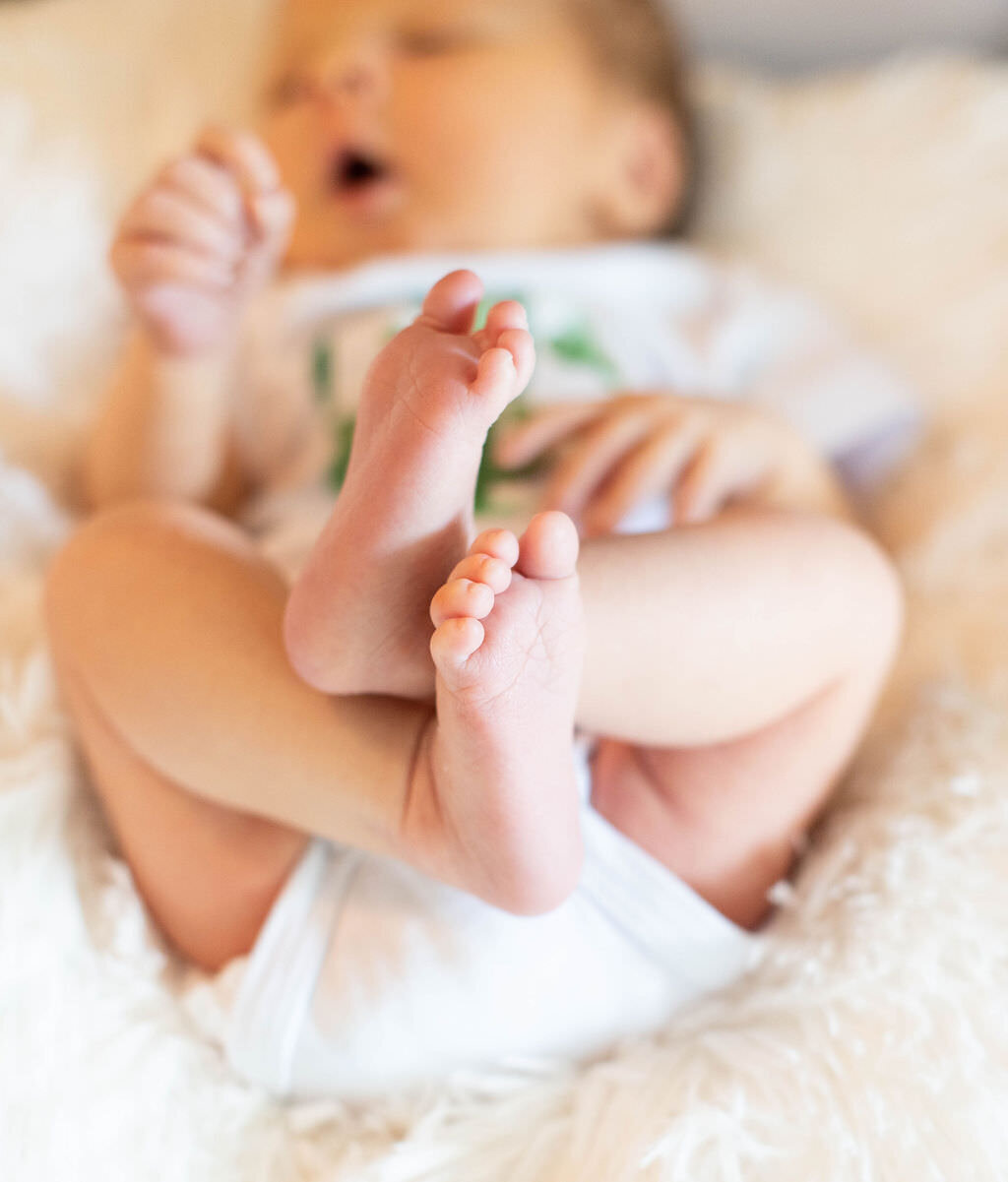 A close up of a newborn baby's feet.