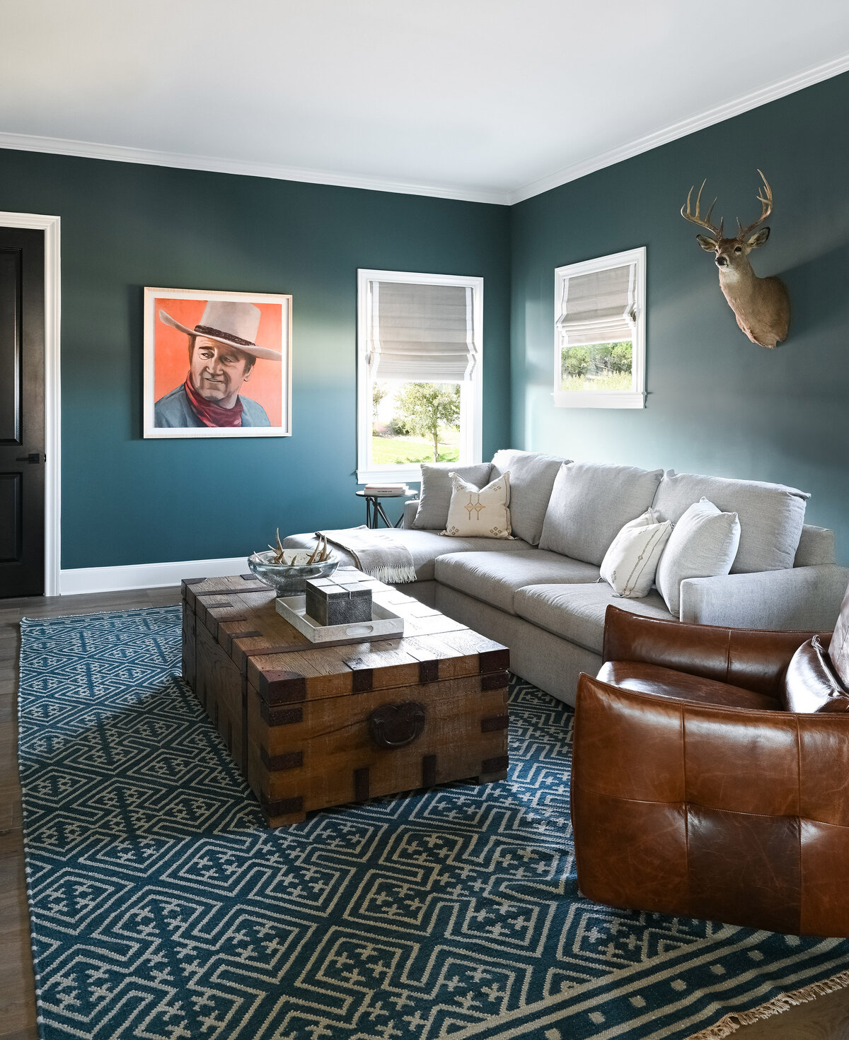 blue green dark walls and leather chair