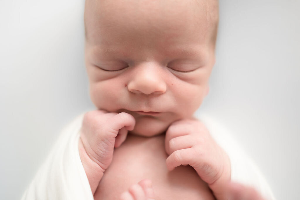 Capturing sweet moments during baby boys newborn photography session in Edmonds, WA