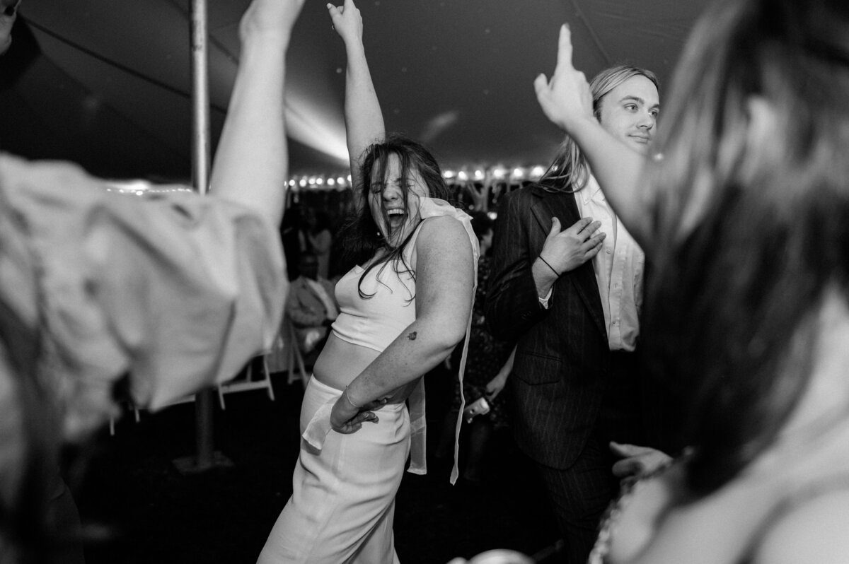 Bride smiling and dancing on the dance floor
