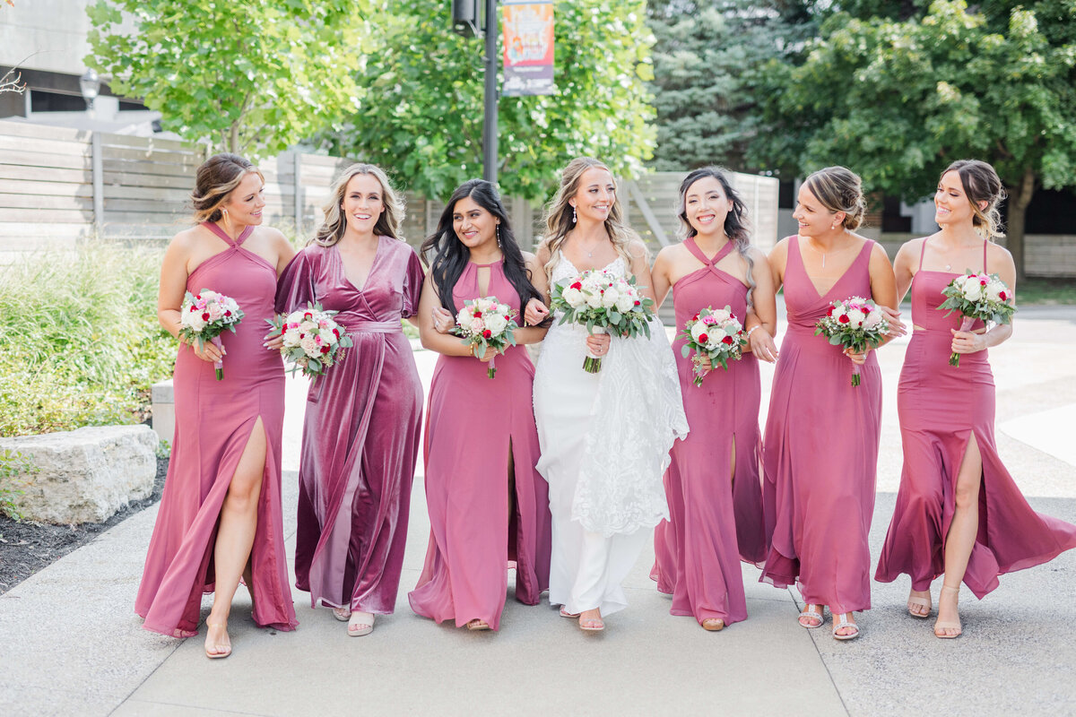 Bride with bridesmaids in pink dresses