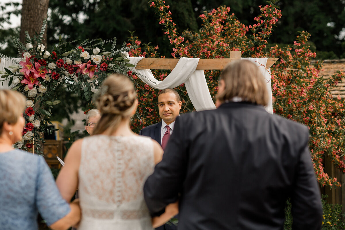 white rock beach wedding ceremony grooms look