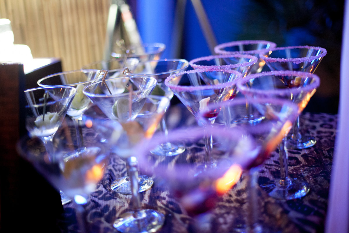 signature cocktail jungle juice martini glasses