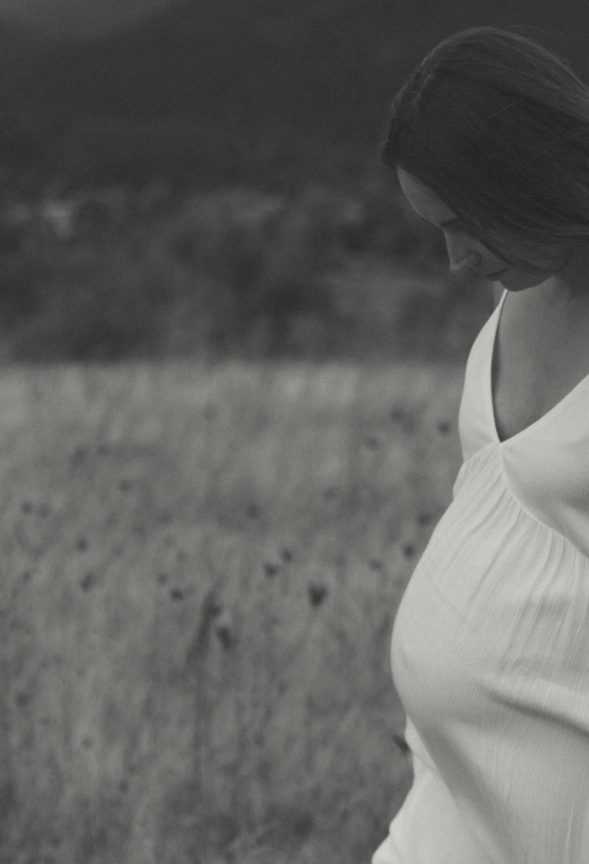 Black and White Outdoor Maternity Photo in White Dress