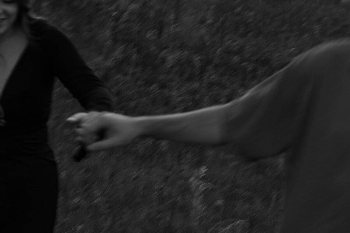 Close up Motion Blur Photo of a couple holding hands 