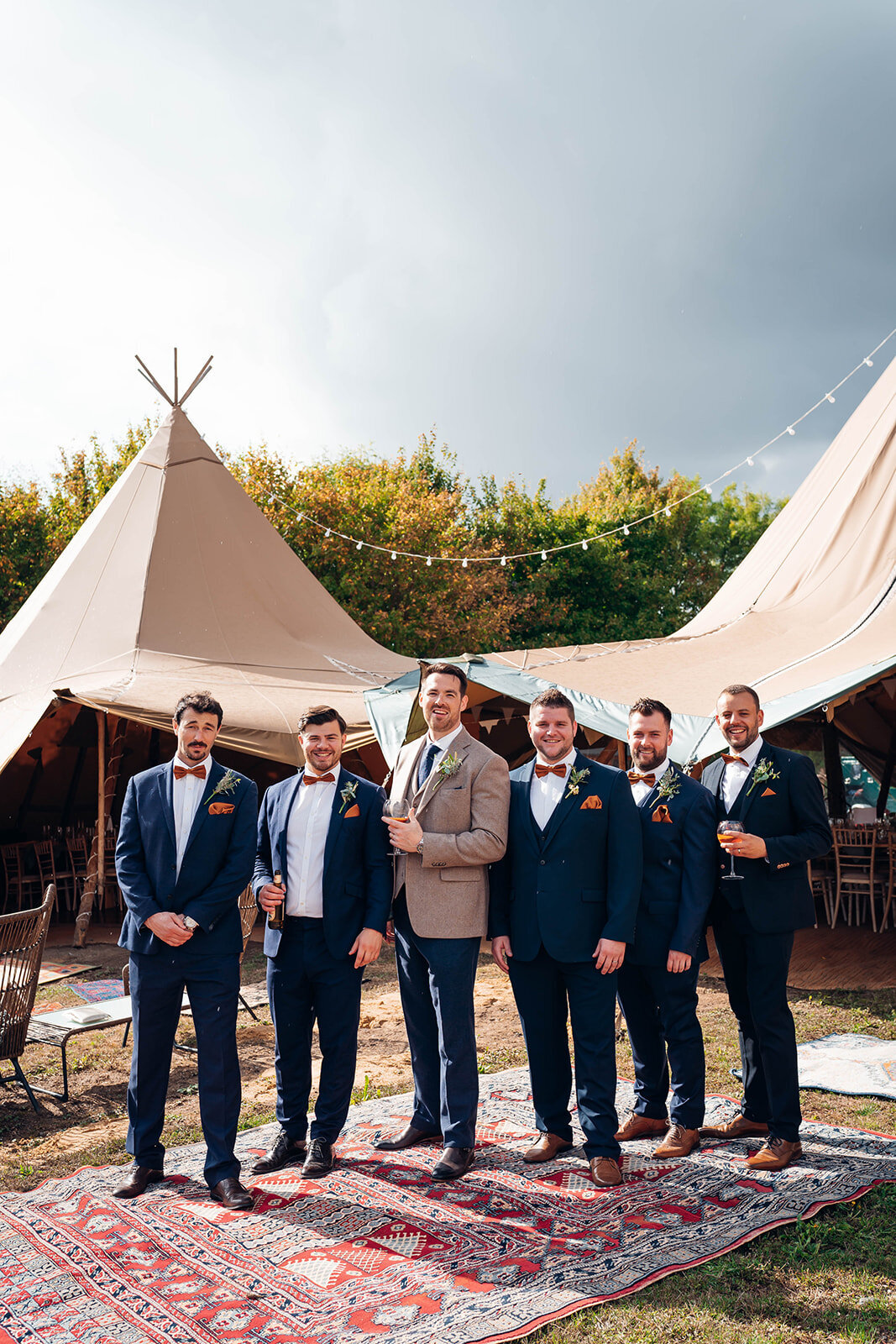 groomsmen-in-front-of-wedding-tipi