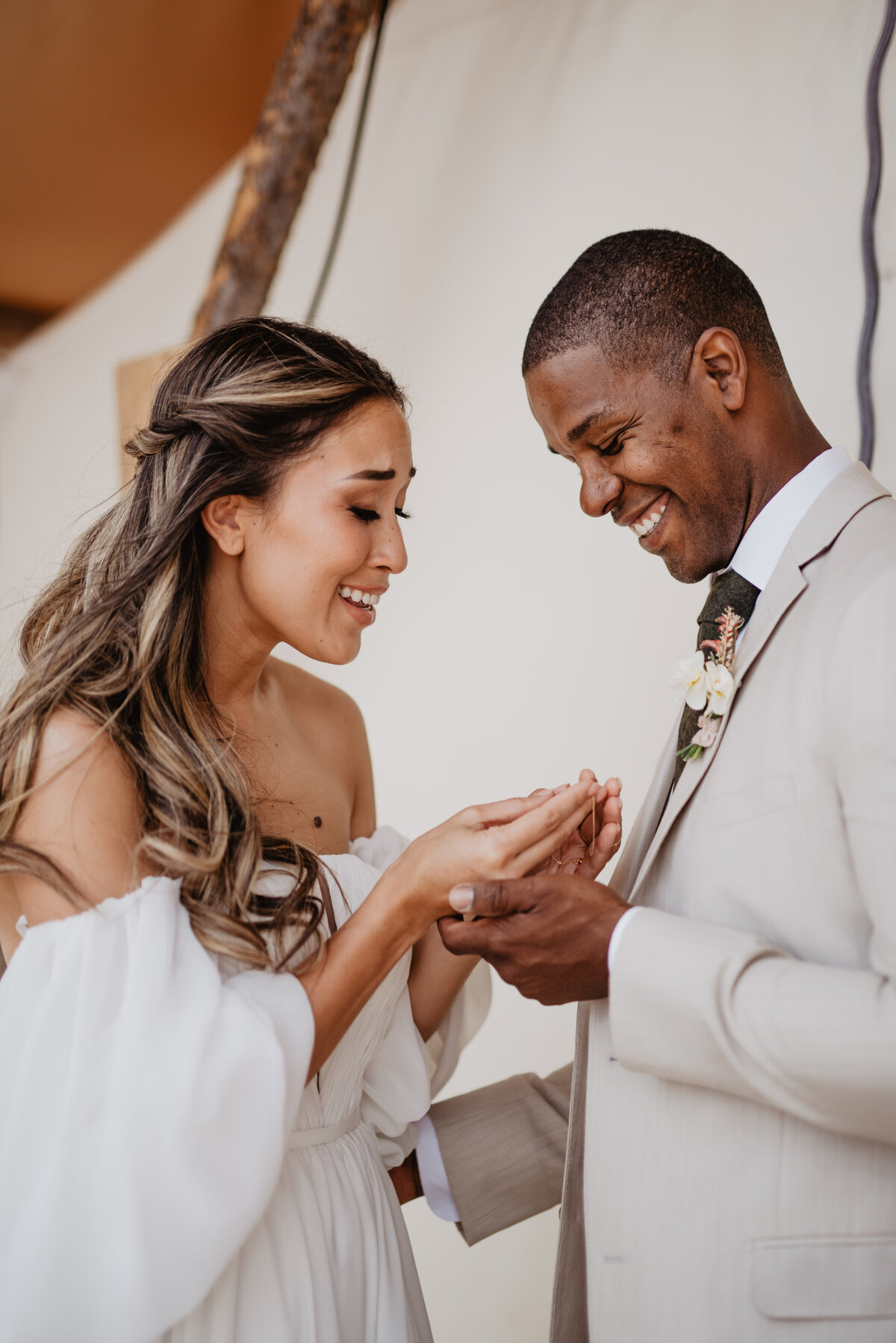 Utah Elopement Photographer captures woman holding necklace and smiling