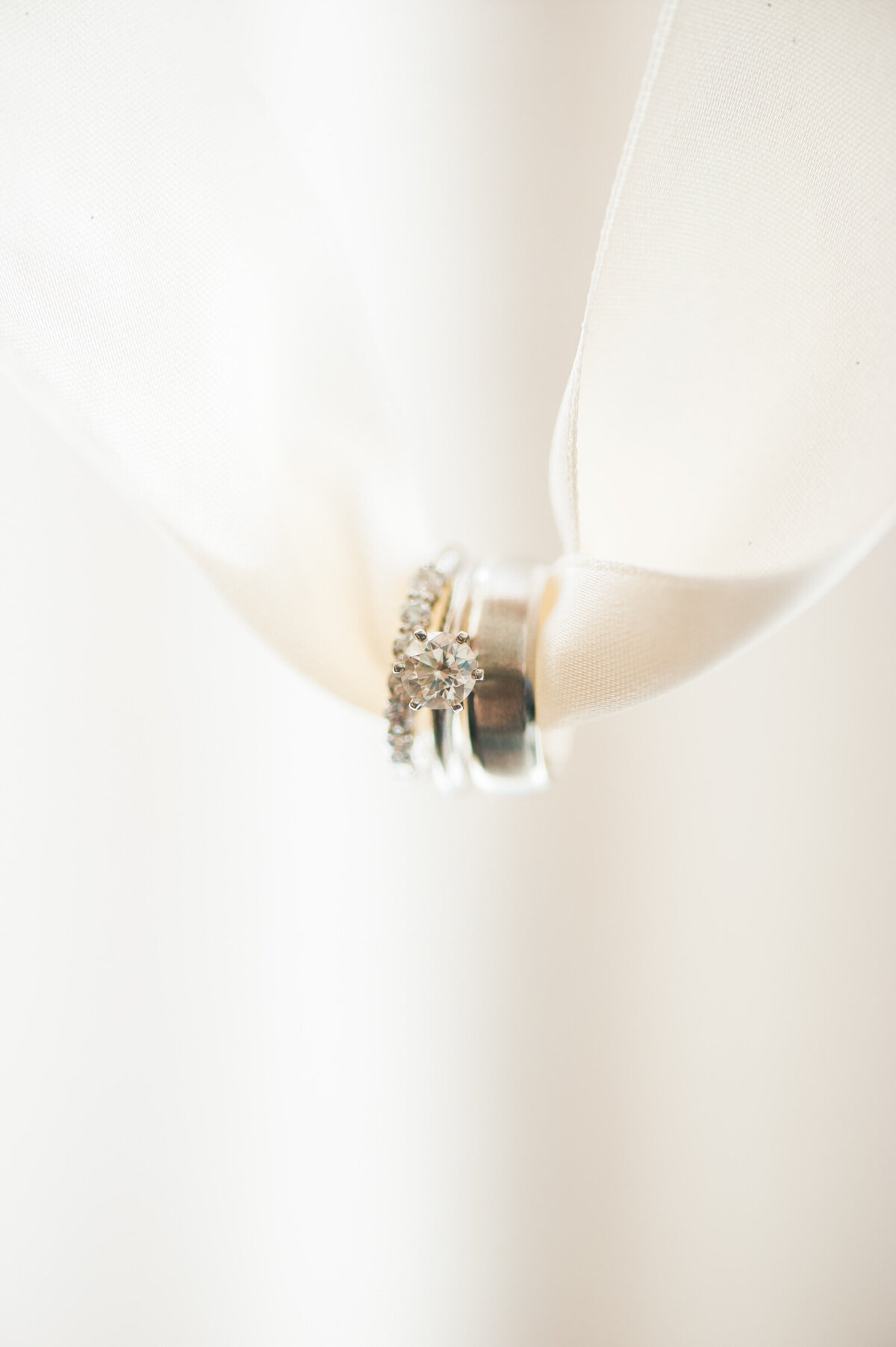 wedding rings hanging on ribbon at ponzi winery