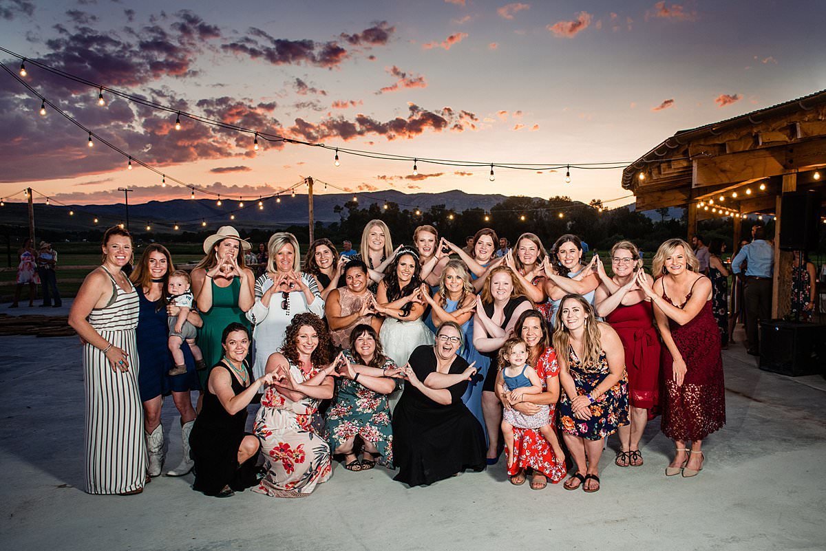 Group photo of bride with all of her Alpha Omicron Pi Alpha Phi chapter alumnae on her wedding day