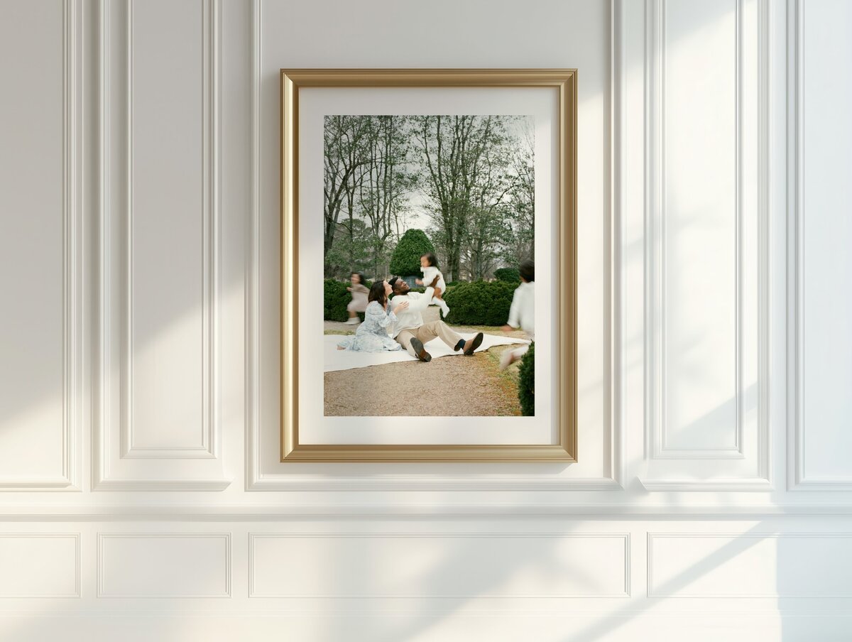 family photo matted and framed on wall with moulding