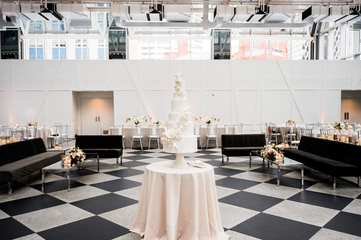 tall white wedding cake by tasty bakery on displace in wintergarden ppg place