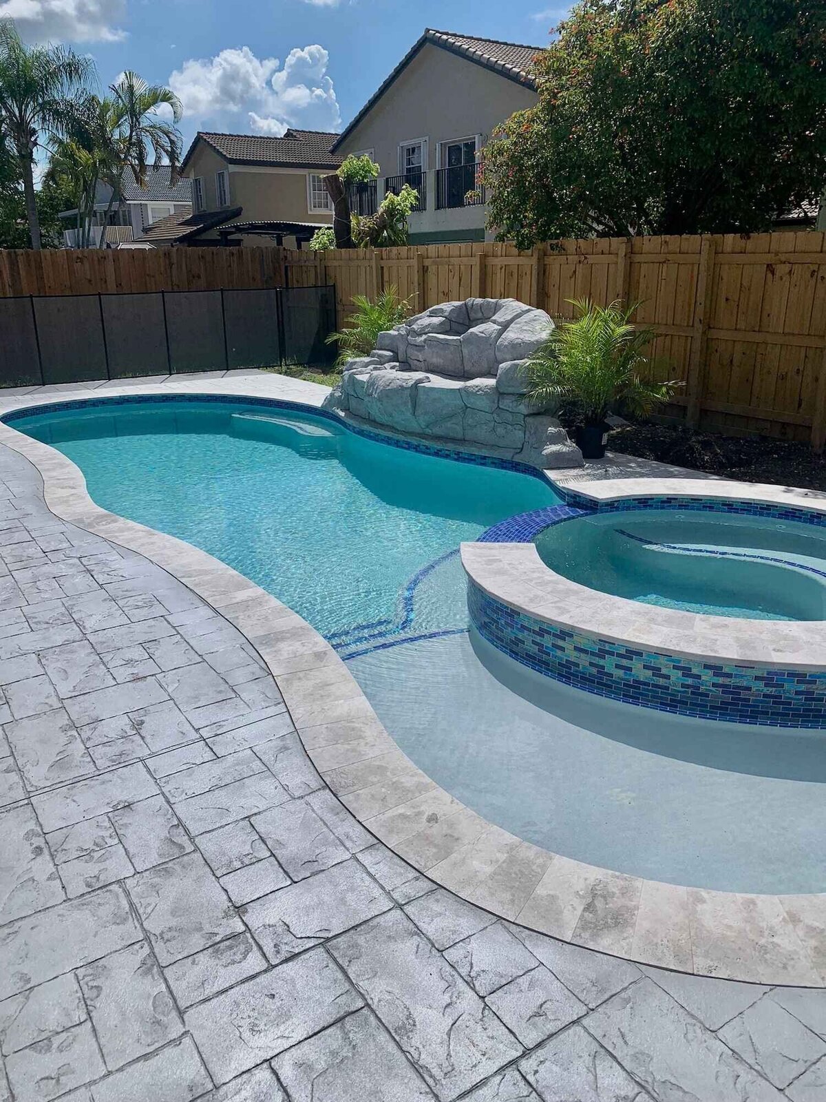 Swimming pool and spa with rocks