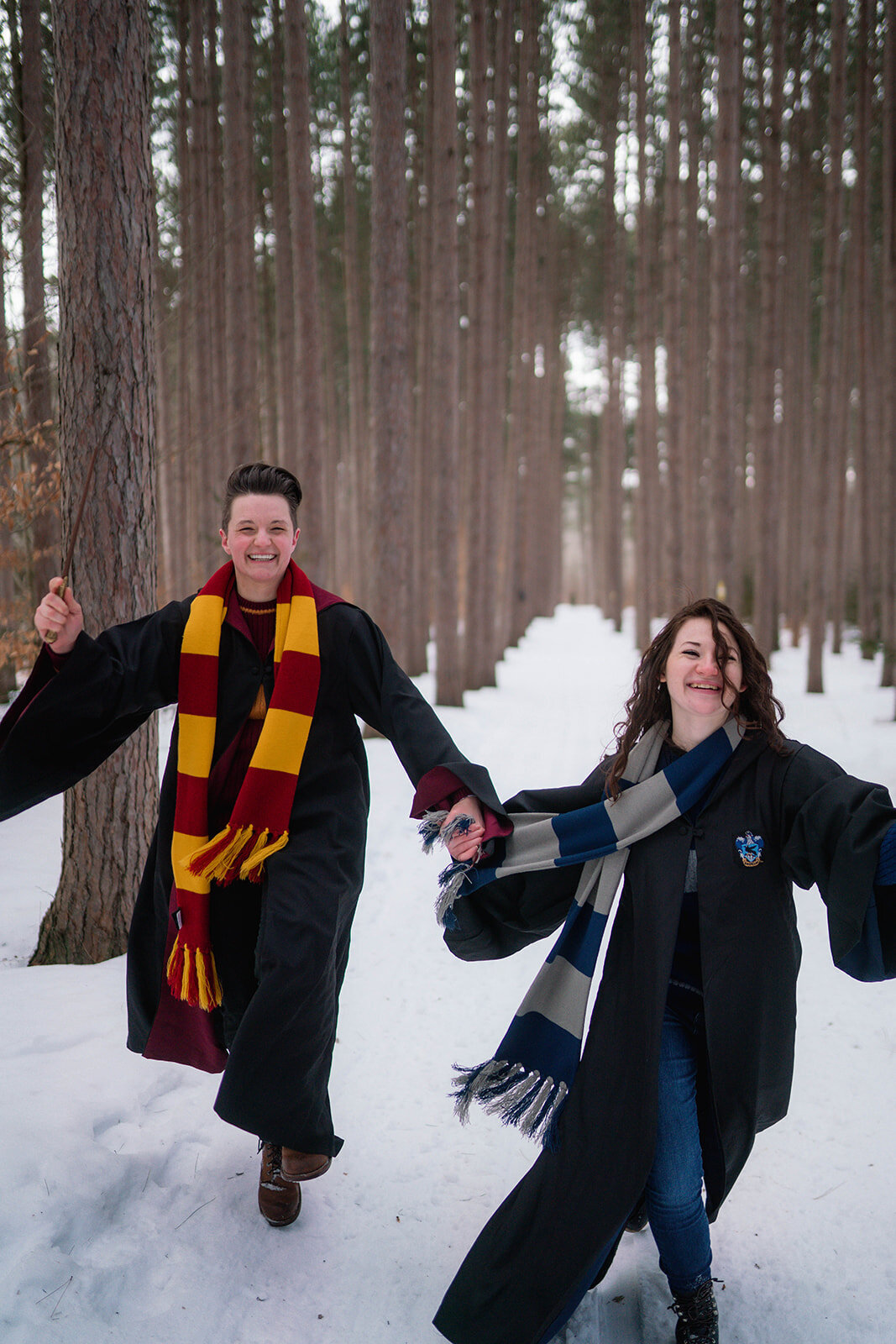 Couple in Harry Potter robes and scarves for a winter engagement session