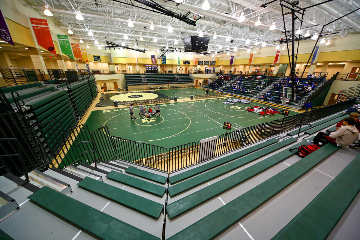 view watching a wrestling match in the gymnasium at the Wesleyan School Athletics building