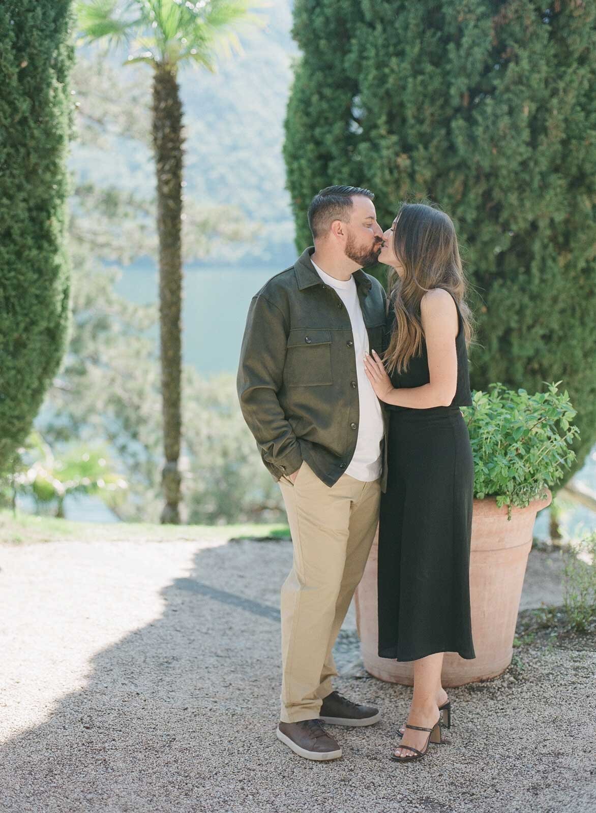 engaged couple's kiss at Lake Como