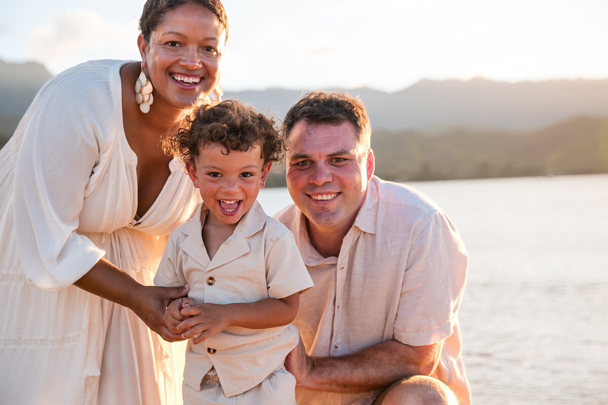 2 parents and their child in kauai
