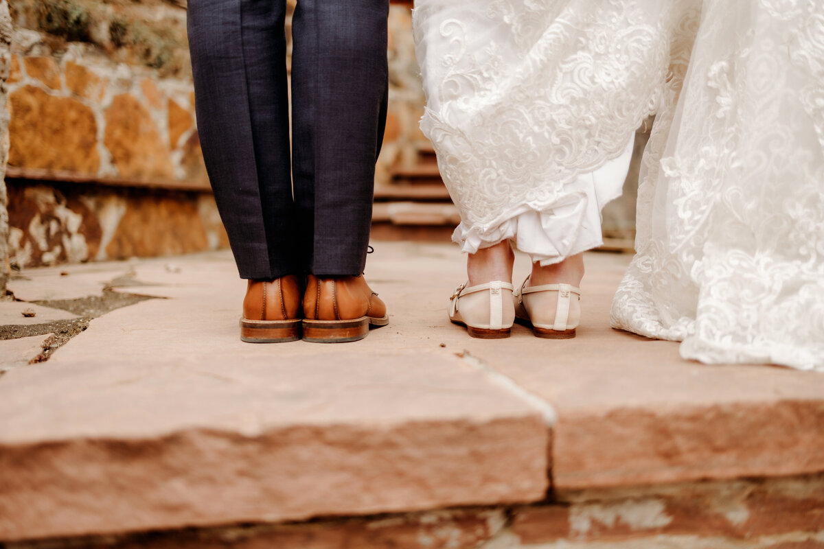 Back of shoes of bride and groom at a Denver wedding venue