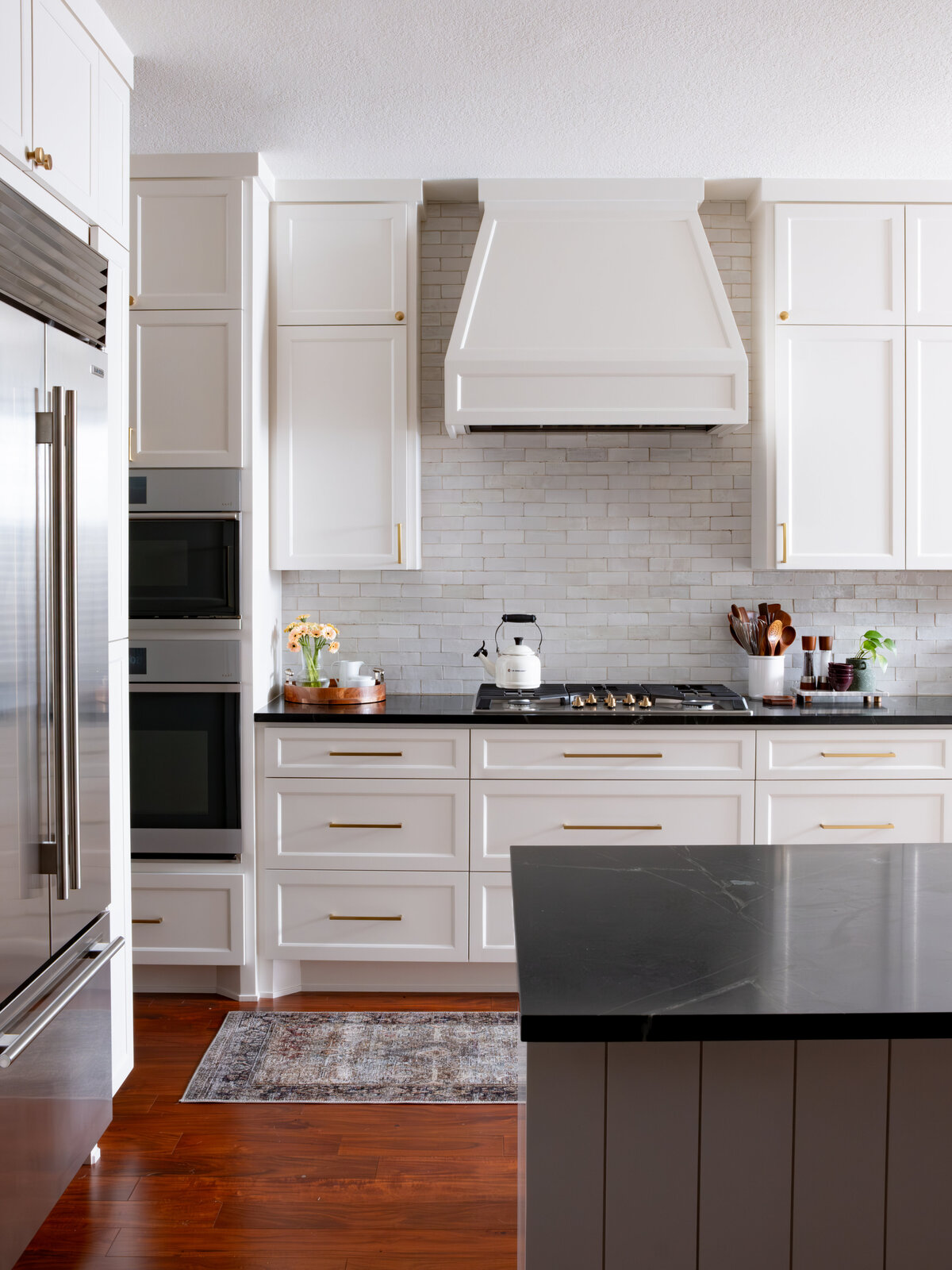 hello-home-austin-cream-kitchen-remodel-zellige-backsplash-contemporary-kitchen-subzero-refrigerator-tapered-vent-hood-1