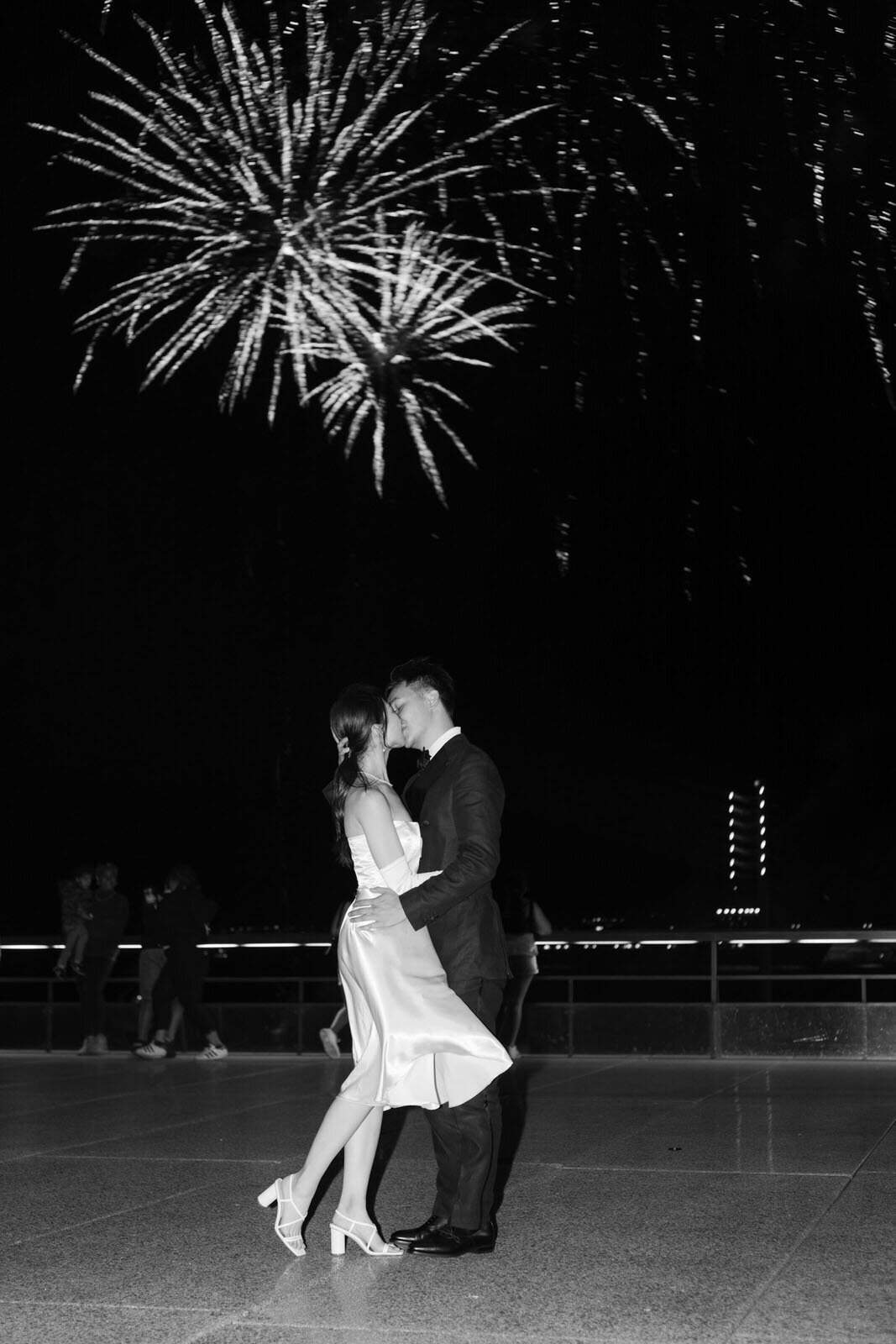 engaged couple's kiss during a firework display