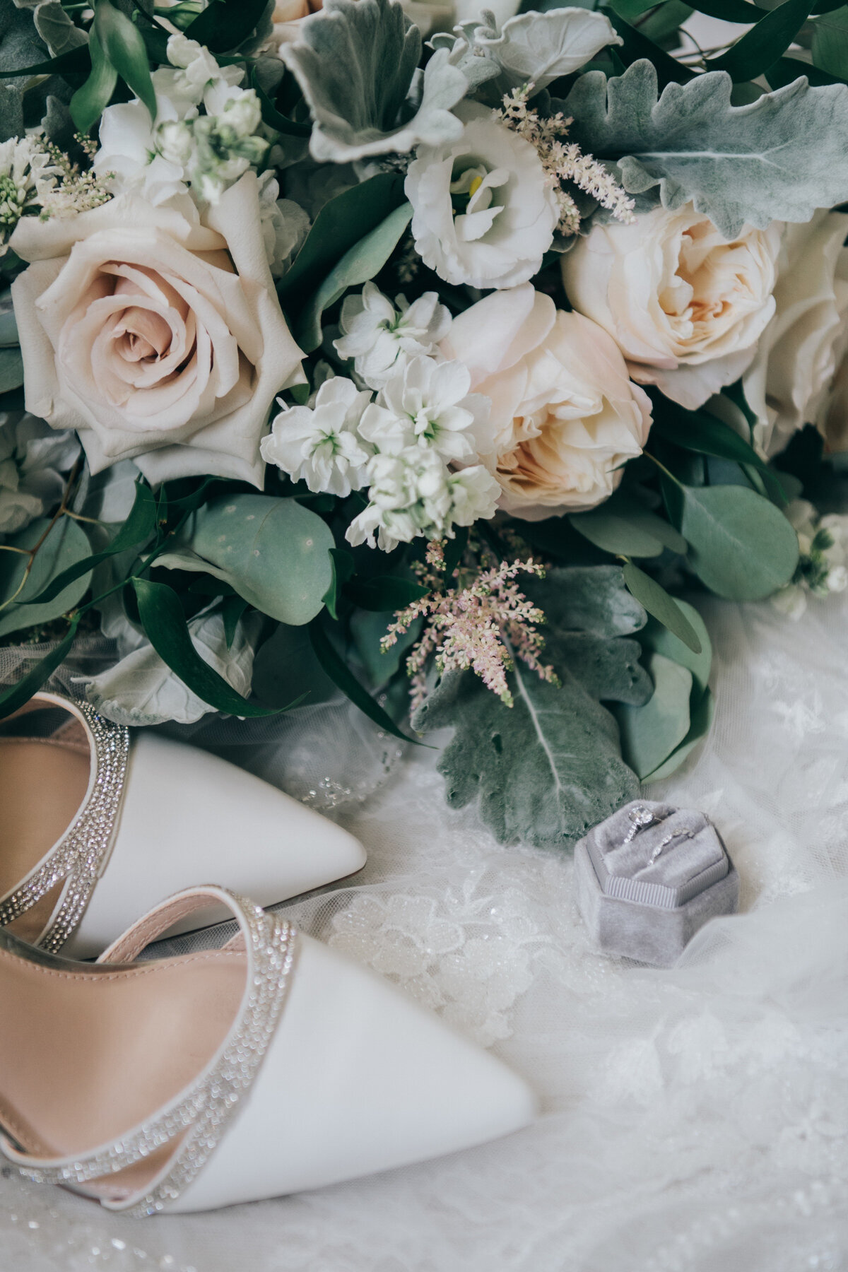 Bridal detail photos with the bride's shoes, bouquet and wedding rings