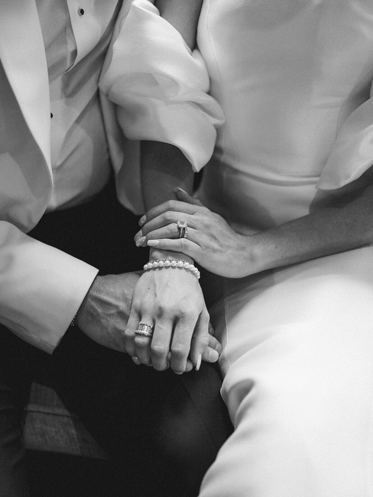 couples hands and their rings