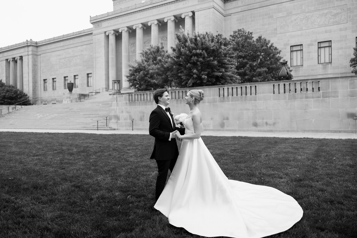 bride and groom after wedding ceremony at nelson atkins museum for wedding party and couples photos with their documentary wedding photograher