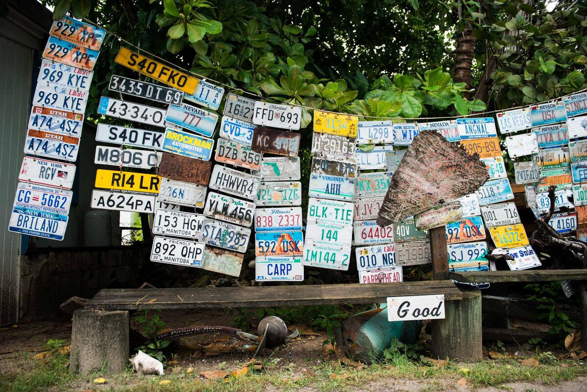 License Plates hang in front of a bench on Harbour Island