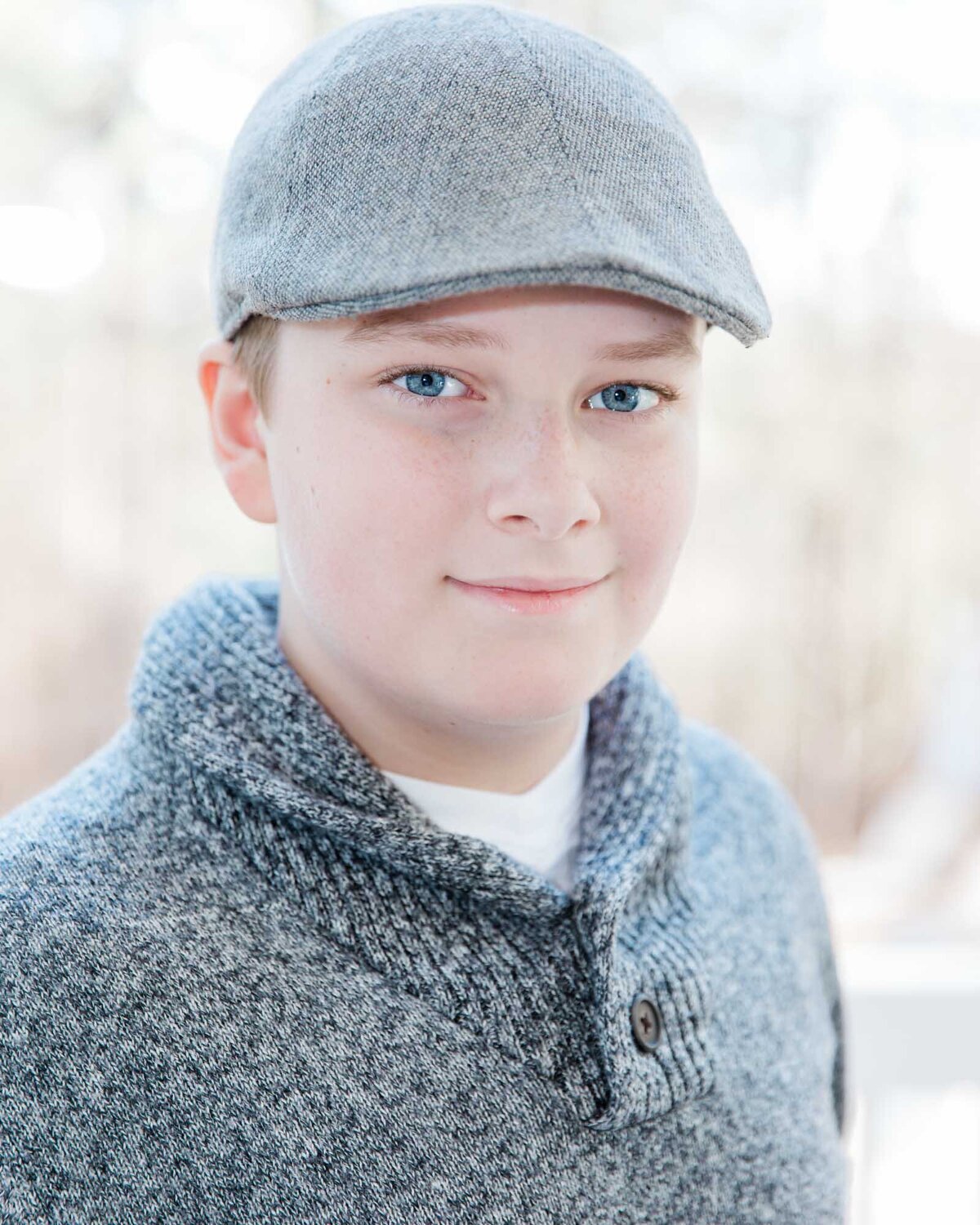 Headshot of a boy whearing a gray hat and sweater in Peachtree City Georgia