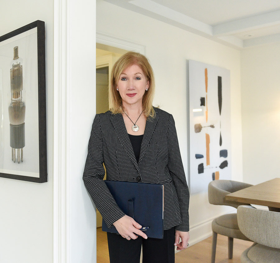 Female realtor showing home