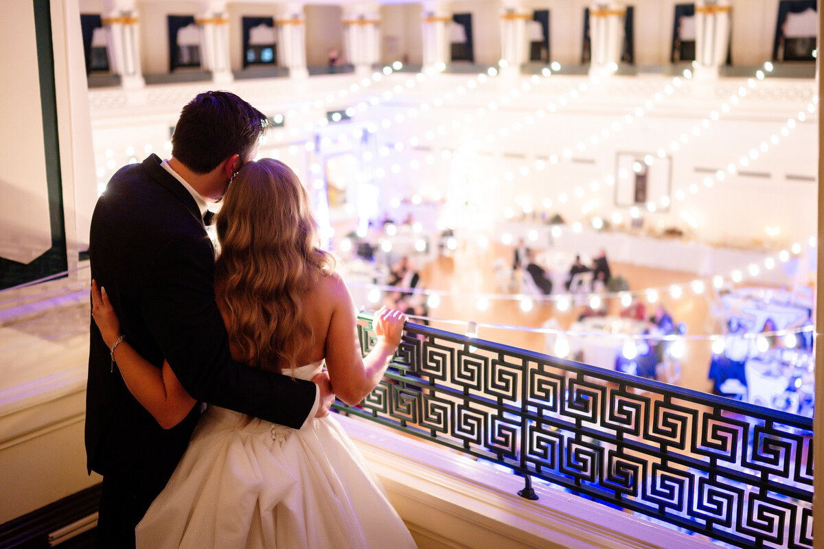 wedding couple overlooking reception at soldiers and sailors memorial hall