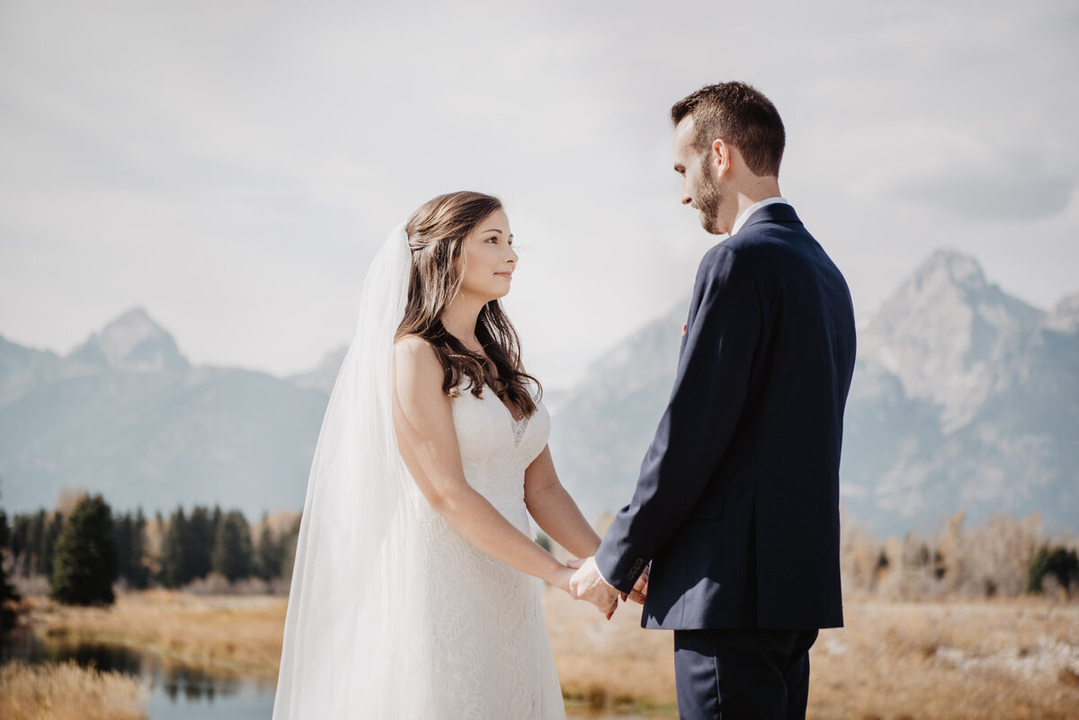 Photographers Jackson Hole capture couple holding hands during Grand Teton elopement