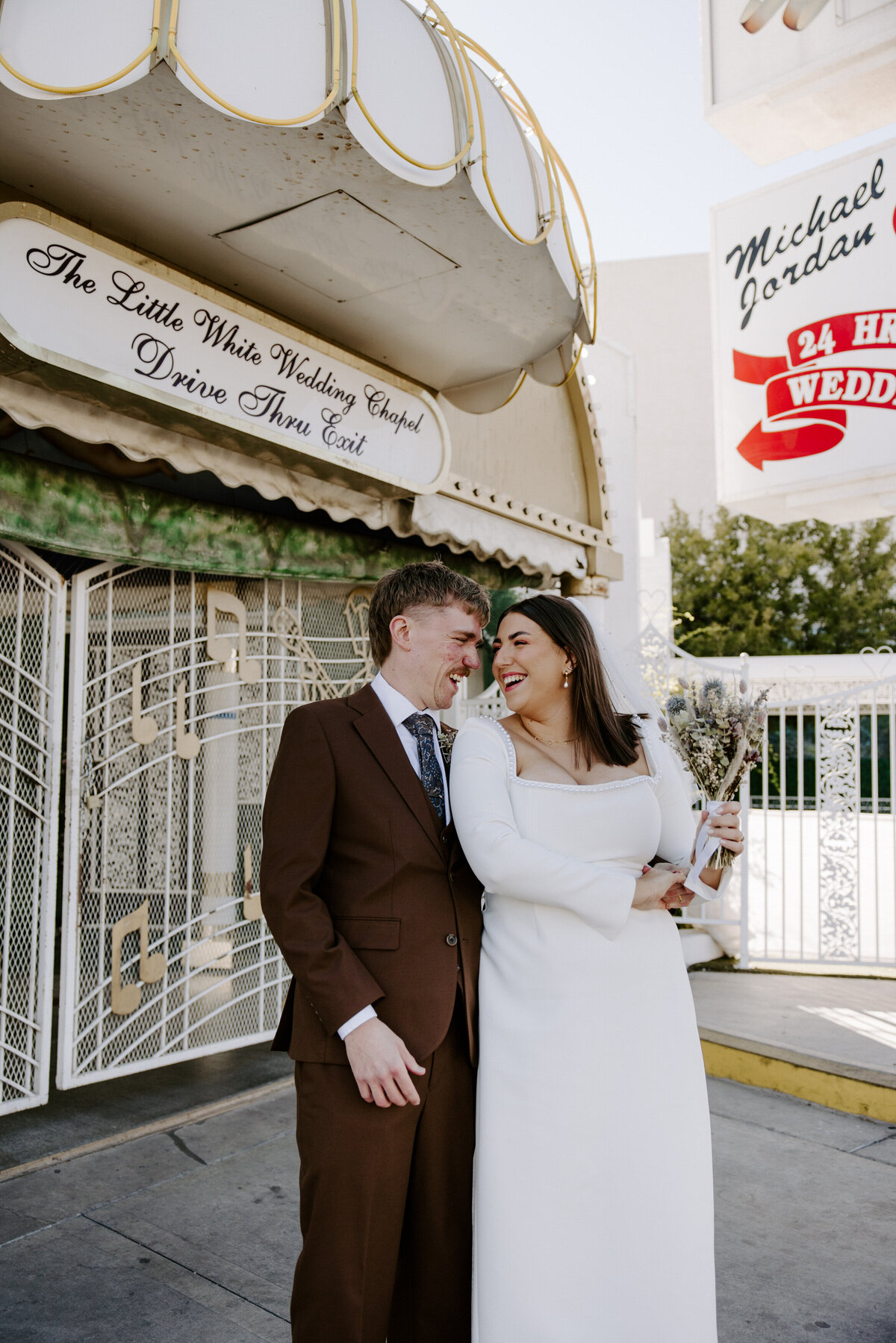 A couple leans in and smiles at a Little White Chapel elopement.