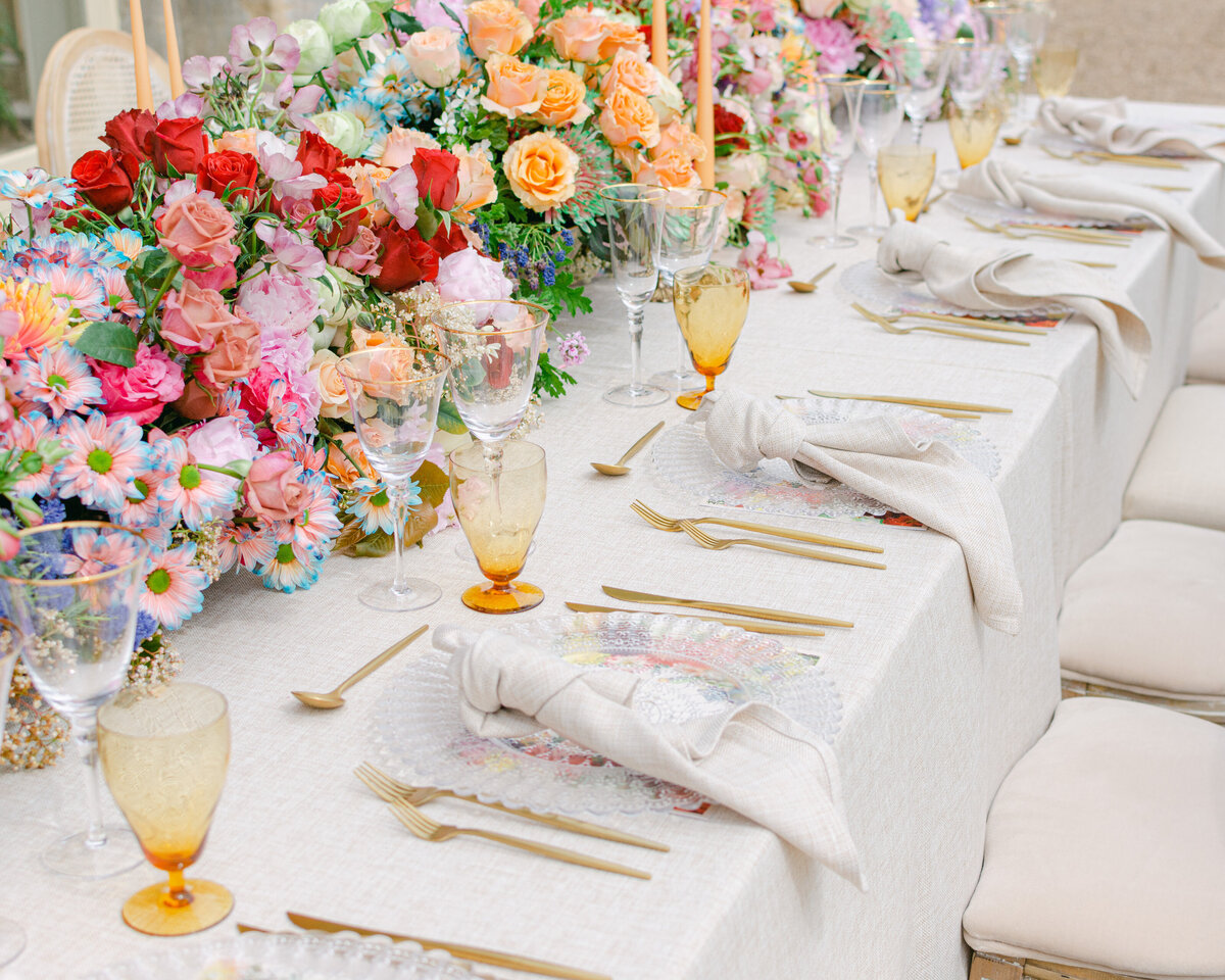 Beautiful wedding table with bright, colourful flowers