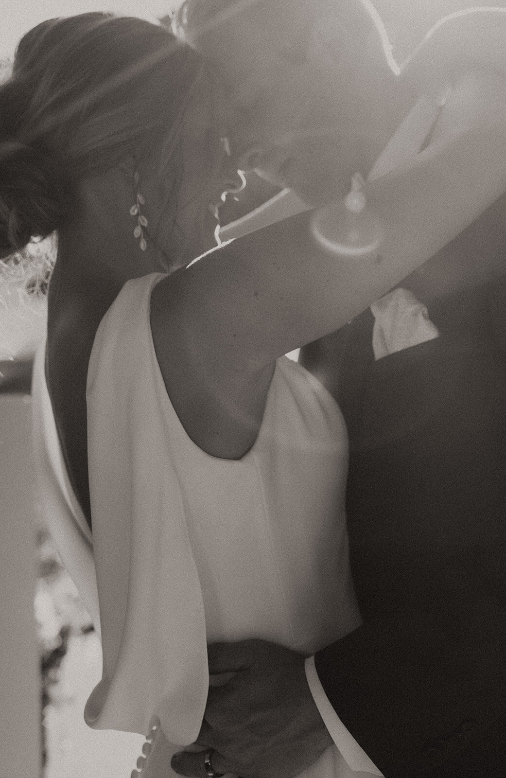 Bride and groom happily facing each other