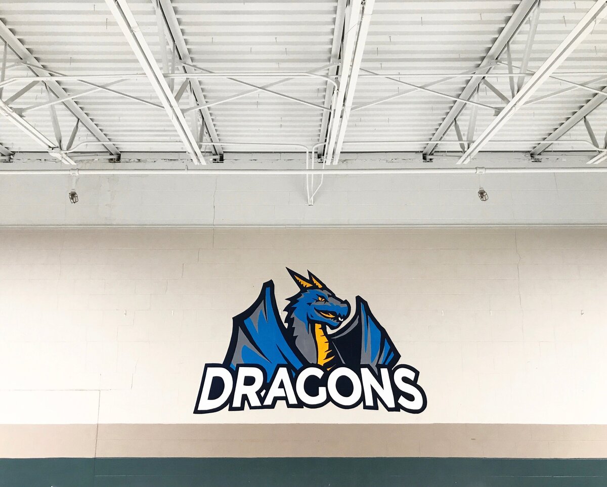 Rochester Math and Scie nce Academy in Rochester Minnesota sign painting mural typography lettering by mural artist muralist Brandy Klindworth of art and design studio Ladder Mouse located in Lake City Minnesota school gymnasium mural